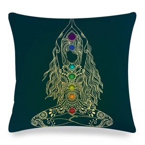 Close-up of Mandana linen cushion cover with golden Yoga 7 Chakra symbols detail