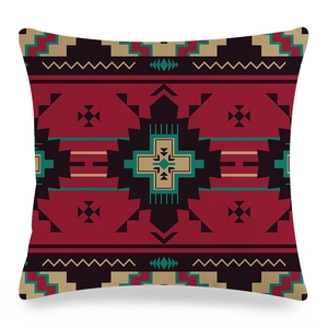 Detailed view of linen pillowcase featuring ethnic geometric patterns in brick red and teal