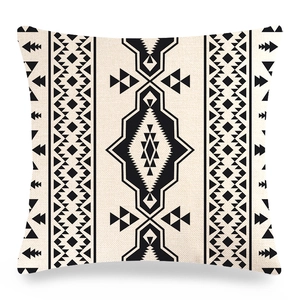 Detailed texture of geometric linen pillowcase with ethnic diamond and arrow patterns
