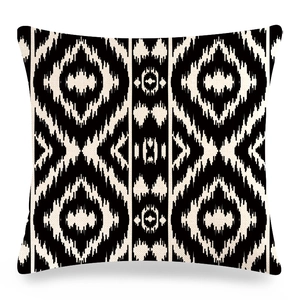 Geometric Ikat linen throw pillow cover with black and white symmetrical pattern