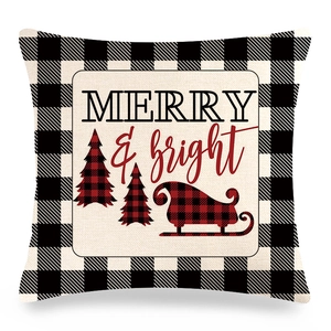 Detail of Christmas buffalo plaid pillow cover featuring Merry and Bright tree print