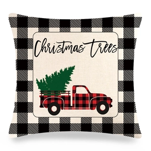 Macro detail of Christmas pillow cover showing linen texture and vintage truck print