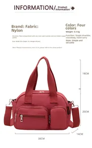 Detailed view of red nylon crossbody bag with dimensions 30x14x20cm and dual zip pockets