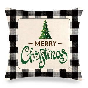 Detail of Christmas pillowcase with buffalo plaid border and green tree design