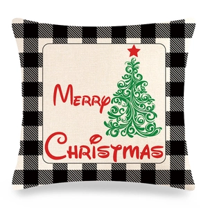 Macro detail of Christmas buffalo check pillowcase with artistic tree and Merry Christmas text