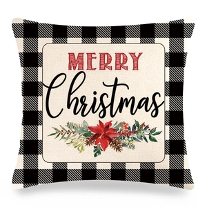 Detail of linen Christmas pillowcase with buffalo plaid edge and festive floral print