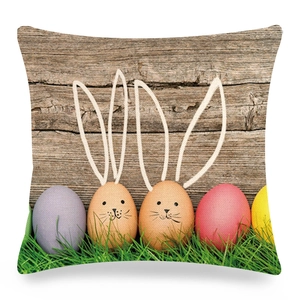 Close-up of Easter linen pillowcase showing colorful eggs on a vintage wood grain background