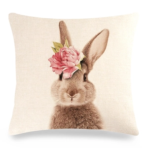 Detailed texture of linen cushion cover with a brown rabbit and pink peony flower
