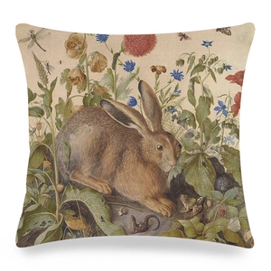 Detail view of Easter linen pillow cover featuring realistic rabbit and floral illustrations
