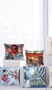 Detail of Christmas linen cushion covers featuring snowman and toy shop patterns