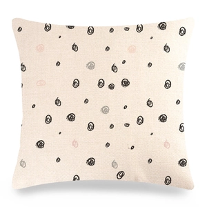 Detailed macro view of the textured linen pillowcase with artistic hand-drawn circle patterns