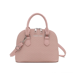 Pink shell handbag with woven texture and adjustable shoulder strap on white background