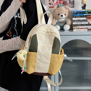 Contrast color canvas backpack for women with moon charm and laptop storage space