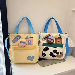 Large canvas cow print tote bag with colorful patches and detachable round coin purse