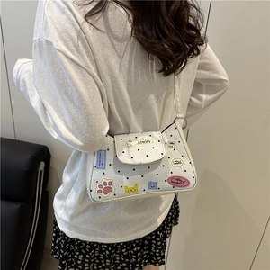 Elegante borsa a tracolla bianca a pois con toppe cartoon colorate per donne giovani