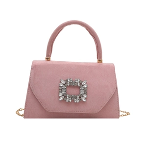 Pink suede crossbody bag with square rhinestone buckle and golden chain strap