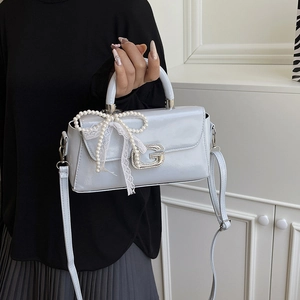 Light blue patent faux leather handbag with pearl lace bow and crystal G buckle detail