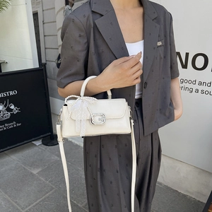 Chic beige crossbody bag with sparkling G-buckle and pearl lace bow accessory