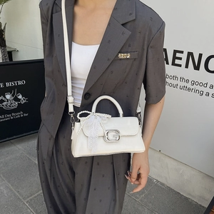 Elegant white PU leather crossbody bag with silver G buckle and pearl lace bow accessory