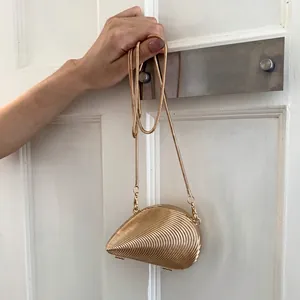 Chic gold shell-shaped acrylic mini evening bag with sleek snake chain and ripple texture