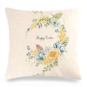 Detail of linen Easter pillow cover with floral wreath, birds and Happy Easter text