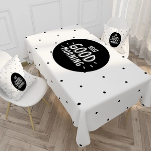 Macro detail of waterproof cotton linen tablecloth with Good Morning print and polka dots
