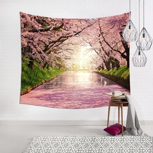 Japanese cherry blossom tapestry hanging on a white wall in a modern living room