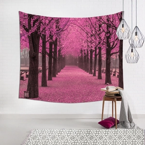 Detail of cherry blossom forest tapestry with vivid pink trees on white brick wall