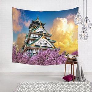 Japanese Osaka Castle and cherry blossoms landscape tapestry on a white brick wall