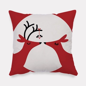 Detail of soft peach skin Christmas pillowcase with red reindeer and holly pattern