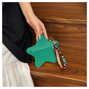 Star-shaped green coin purse with LOVE lettering wristlet and gold zipper detail