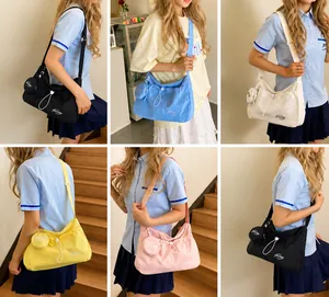 Detail view of colorful nylon shoulder bags with drawstring and mini round coin pouches