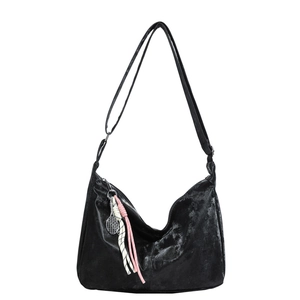 Minimalist black hobo shoulder bag with tennis racket charm and sport knot detail