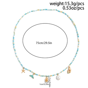 Detailed view of beaded beach waist chain with starfish, shell, and fishtail charms
