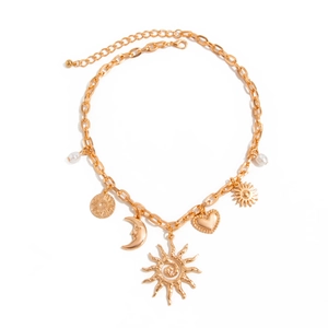 Gold chunky chain necklace featuring sun, crescent moon, heart and pearl charms