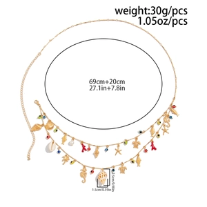 Detail of gold beach waist chain with sea charms and length measurements of 69cm plus 20cm