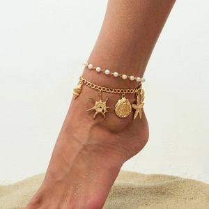 Gold double-layered beach anklet with white pearls, starfish and seashell pendants