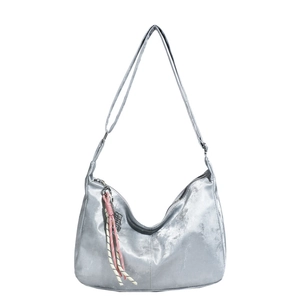 Silver metallic hobo shoulder bag with a woven charm and adjustable strap for women