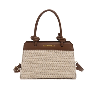 Gewebte Stroh- und braune Lederhandtasche mit geknotetem Griff für sommerlichen Stil