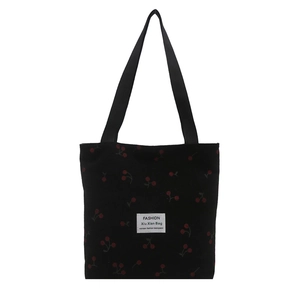Minimalist black corduroy tote bag with red cherry print and fashion label detail