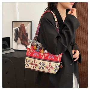 Detail of colorful ethnic pattern weave and vibrant tassel fringe on the shoulder tote bag