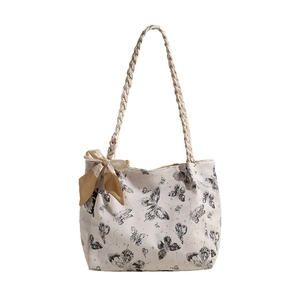 Chic butterfly print tote bag in cream white with decorative scarf and woven handles