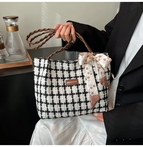 Detail of tweed tote bag with woven handles, silk scarf, and Fashion & Bags leather logo