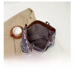 Interior view showing the large capacity and ethnic pattern of this square tote bag