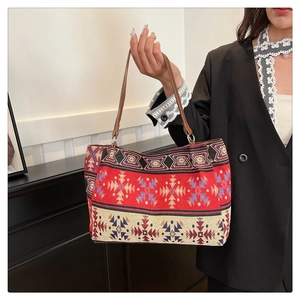 Close-up of ethnic jacquard pattern and leather straps on this stylish tote bag
