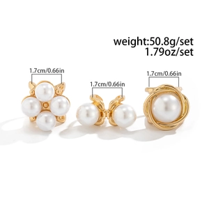 Detailed view of three gold rings with pearls, showing weights and 1.7cm width dimensions