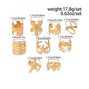 Set of 9 gold ocean-themed rings featuring starfish and shells with diameter measurements