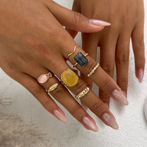 Gold-toned liquid metal wrinkle ring set with colorful synthetic gemstones for women