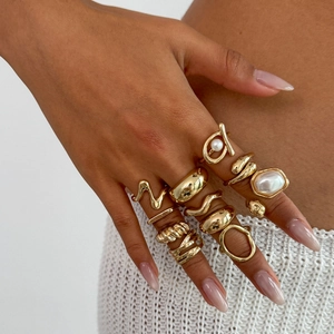 Golden baroque pearl ring set with geometric wave patterns for layered stackable styling