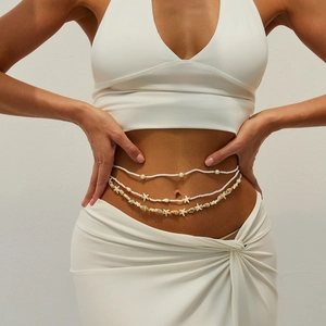Three-layer bohemian waist chain with starfish shells and white beads on model